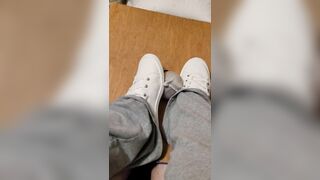 Rubbing his cock with white shoes