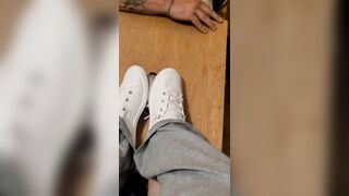 Rubbing his cock with white shoes