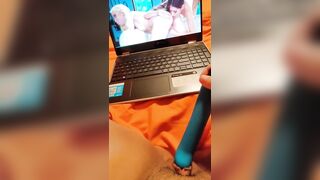 Watching lesbian porn while masturbating my wet pussy
