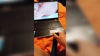 Watching lesbian porn while masturbating my wet pussy