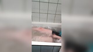 lie in the bathroom and play with your tits