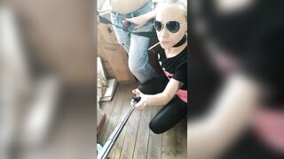 Russian girl smokes and sucks on the balcony