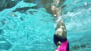 Slick body and pointed toes, pool socks and PVC swimming costumes