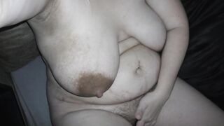 Slutwife Milky Mari starting to masturbate her very hairy pussy while her huge boobs are flowing with a breast milk