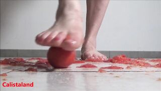 Several tomatoes are crushed under my wonderful bare feet