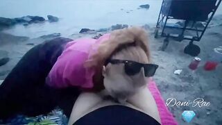 Hot redhead milf Dani Rae Diamond slurps cock at sunset on a public beach