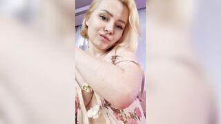Beautiful blonde shows juicy natural tits and touches shaved pussy