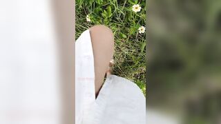 Girl watering Wild Flowers with her Pee on the Roadside
