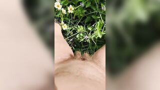 Girl watering Wild Flowers with her Pee on the Roadside