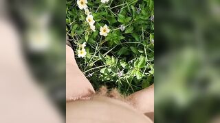 Girl watering Wild Flowers with her Pee on the Roadside