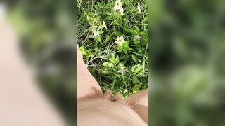 Girl watering Wild Flowers with her Pee on the Roadside
