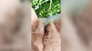 Girl watering Wild Flowers with her Pee on the Roadside