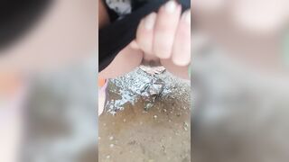 Girl Peed desperately in the rain to the puddle