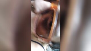 Sexy Latin girl in sunglasses sucking by crowded waterfall