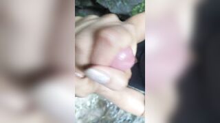 Sexy Latin girl in sunglasses sucking by crowded waterfall