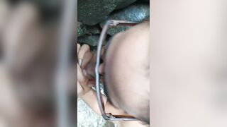 Sexy Latin girl in sunglasses sucking by crowded waterfall