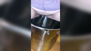 Sexy milf pisses in pot