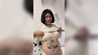 Chubby Asian woman undressing