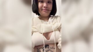 Chubby Asian woman undressing